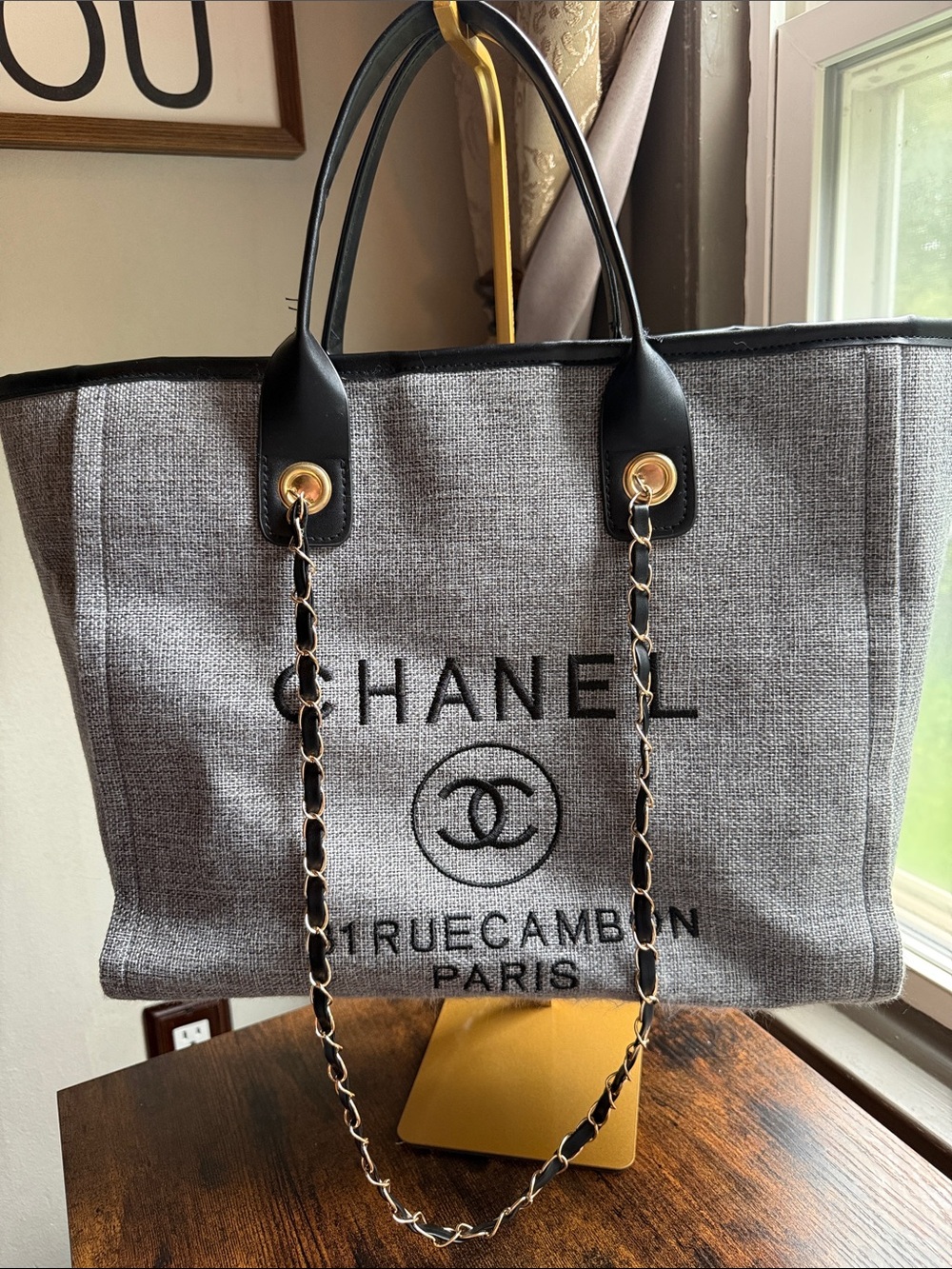 CHANEL Gray Canvas Tote with Black Trim and Gold Chain Handles